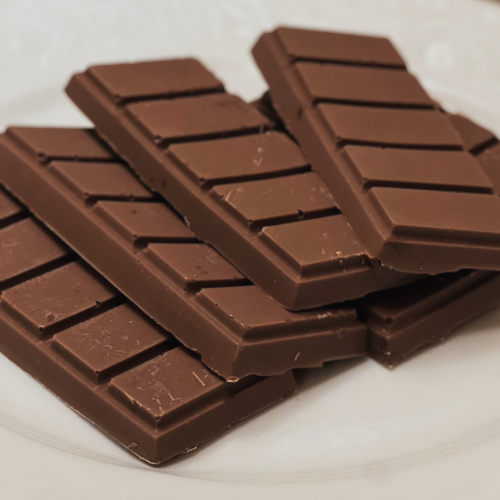 Nature’s Magic mushroom chocolate bar pieces arranged on a plate